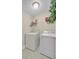 Functional laundry room with white washer and dryer and overhead shelving at 219 Whirlaway Dr, Moncks Corner, SC 29461