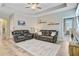 Inviting living room featuring a ceiling fan, recessed lights, and comfortable leather couches at 219 Whirlaway Dr, Moncks Corner, SC 29461