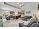 Open floor plan with a modern kitchen, living room, and comfortable leather couches at 219 Whirlaway Dr, Moncks Corner, SC 29461