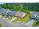 A charming street view of well maintained homes with lush green lawns and mature trees at 219 Whirlaway Dr, Moncks Corner, SC 29461