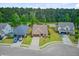 A charming street view of well maintained homes with lush green lawns and mature trees at 219 Whirlaway Dr, Moncks Corner, SC 29461