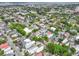 Wide aerial shot of a city with colorful rooftops, tree-lined streets, and various building styles at 221 Ashley Ave # Abc, Charleston, SC 29403