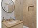 Bathroom featuring a modern vanity with a stone countertop, a round mirror, and tiled walls at 221 Ashley Ave # Abc, Charleston, SC 29403