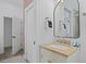 Bathroom featuring a vanity with neutral countertop, a mirror, and a closet for storage at 221 Ashley Ave # Abc, Charleston, SC 29403