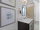 Bright bathroom with neutral tones, modern marble vanity and decor for a relaxing retreat at 221 Ashley Ave # Abc, Charleston, SC 29403