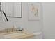 Well-lit bathroom features a sink with a stone countertop at 221 Ashley Ave # Abc, Charleston, SC 29403