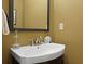Bathroom features a large mirror, dark trim and vanity with white sink at 221 Ashley Ave # Abc, Charleston, SC 29403