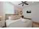Relaxing bedroom with neutral tones, two windows, and decor for a serene and comfortable retreat at 221 Ashley Ave # Abc, Charleston, SC 29403