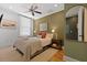 Bedroom with ceiling fan, hardwood floors, and natural light at 221 Ashley Ave # Abc, Charleston, SC 29403