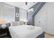 Cozy bedroom with neutral walls, a comfortable bed, and plenty of natural light from the large windows at 221 Ashley Ave # Abc, Charleston, SC 29403