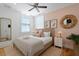 Relaxing bedroom with neutral tones, two windows, and decor for a serene and comfortable retreat at 221 Ashley Ave # Abc, Charleston, SC 29403