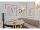 Eat-in dining room with a modern glass table and booth seating at 221 Ashley Ave # Abc, Charleston, SC 29403