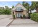 Charming carriage house featuring brick accents, an upper level balcony, and private parking at 221 Ashley Ave # Abc, Charleston, SC 29403