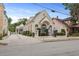 Elegant building with historic charm, showcasing arched windows, manicured landscaping, and welcoming entrance at 221 Ashley Ave # Abc, Charleston, SC 29403