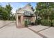 Unique home with a balcony, brick accents, and a well-manicured yard on a sunny day at 221 Ashley Ave # Abc, Charleston, SC 29403