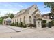 Elegant building featuring a white facade, arched windows, and manicured landscaping at 221 Ashley Ave # Abc, Charleston, SC 29403