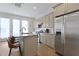 Well-equipped kitchen featuring stainless steel appliances, a breakfast bar, and neutral cabinetry at 221 Ashley Ave # Abc, Charleston, SC 29403