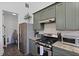 Kitchen featuring stainless steel appliances, granite countertops, and ample cabinet space at 221 Ashley Ave # Abc, Charleston, SC 29403