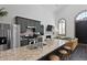 Open kitchen flows into the living room; granite countertops and stainless appliances at 221 Ashley Ave # Abc, Charleston, SC 29403