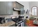 Kitchen features granite counters, stainless appliances, and modern finishes at 221 Ashley Ave # Abc, Charleston, SC 29403