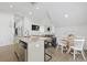Bright living room with dining area, comfortable seating, and an open layout with kitchen view at 221 Ashley Ave # Abc, Charleston, SC 29403