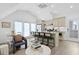 Bright living room with dining area, comfortable seating, and an open layout with kitchen view at 221 Ashley Ave # Abc, Charleston, SC 29403