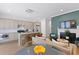 Open-concept living room and kitchen with bar seating and a cozy fireplace at 221 Ashley Ave # Abc, Charleston, SC 29403