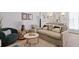 Comfortable living room with stylish furniture, hardwood floors, and lots of light at 221 Ashley Ave # Abc, Charleston, SC 29403