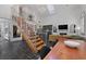 Open-concept space with vaulted ceiling, staircase, sleek kitchen, and modern decor at 221 Ashley Ave # Abc, Charleston, SC 29403