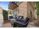 Comfortable patio with wicker furniture and stylish brickwork, perfect for outdoor relaxation at 221 Ashley Ave # Abc, Charleston, SC 29403