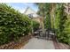 Outdoor patio with seating, greenery, and brick accents provide a relaxing space at 221 Ashley Ave # Abc, Charleston, SC 29403