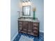 Stylish bathroom vanity with granite countertop, dark wood cabinets, and modern fixtures at 23 Forde Row, Charleston, SC 29412