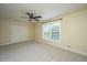 Bright bedroom featuring a ceiling fan, carpeted floors and large window at 23 Forde Row, Charleston, SC 29412