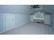 Finished bonus room with storage closets and a built-in desk under an arched window at 23 Forde Row, Charleston, SC 29412