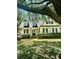 Charming home with tidy landscaping, green lawn, and a delightful covered porch at 23 Forde Row, Charleston, SC 29412