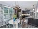 Eat-in kitchen featuring stainless appliances, granite countertops, dark cabinetry, and a modern chandelier at 23 Forde Row, Charleston, SC 29412
