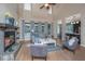 Cozy living room with a stone fireplace, vaulted ceilings, and natural light, creating a warm and inviting atmosphere at 23 Forde Row, Charleston, SC 29412