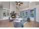 Inviting living room with a fireplace, built-in bookshelves, and comfortable seating, perfect for relaxation and entertaining at 23 Forde Row, Charleston, SC 29412