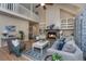 Cozy living room with a fireplace, vaulted ceilings, and comfortable seating, creating a welcoming space at 23 Forde Row, Charleston, SC 29412