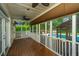 Screened porch with ceiling fans offers serene pool views and a relaxing outdoor space at 23 Forde Row, Charleston, SC 29412
