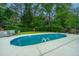 Private backyard featuring an in-ground pool, mature trees, and ample space for entertaining at 23 Forde Row, Charleston, SC 29412