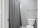 A clean bathroom has a gray waffle weave shower curtain and chrome hardware at 250 Grand Oaks Dr, Ladson, SC 29456
