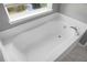 Bathroom with white tub and tile flooring at 250 Grand Oaks Dr, Ladson, SC 29456