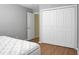 This bedroom has wood-look floors and closet with bi-fold doors for optimal storage at 250 Grand Oaks Dr, Ladson, SC 29456