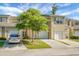 Charming townhome featuring a single-car garage and a well-manicured front lawn with a tree at 250 Grand Oaks Dr, Ladson, SC 29456