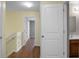 Bright hallway with wood floors leading to bathroom and bedroom at 250 Grand Oaks Dr, Ladson, SC 29456
