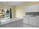 Bright kitchen with island, white cabinets, modern appliances, and a view of the water at 250 Grand Oaks Dr, Ladson, SC 29456