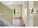 Bright living room with natural light streaming through windows, adjacent to stairs at 250 Grand Oaks Dr, Ladson, SC 29456