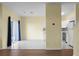 A living space with tile and wood floors that connects to the kitchen with white cabinets and appliances at 250 Grand Oaks Dr, Ladson, SC 29456