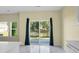An open living space with a view of the pond and fountain from the patio sliding glass door at 250 Grand Oaks Dr, Ladson, SC 29456